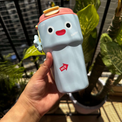 Blue sipper bottle with a relaxing smiley face design